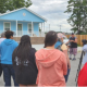 people in front of a house